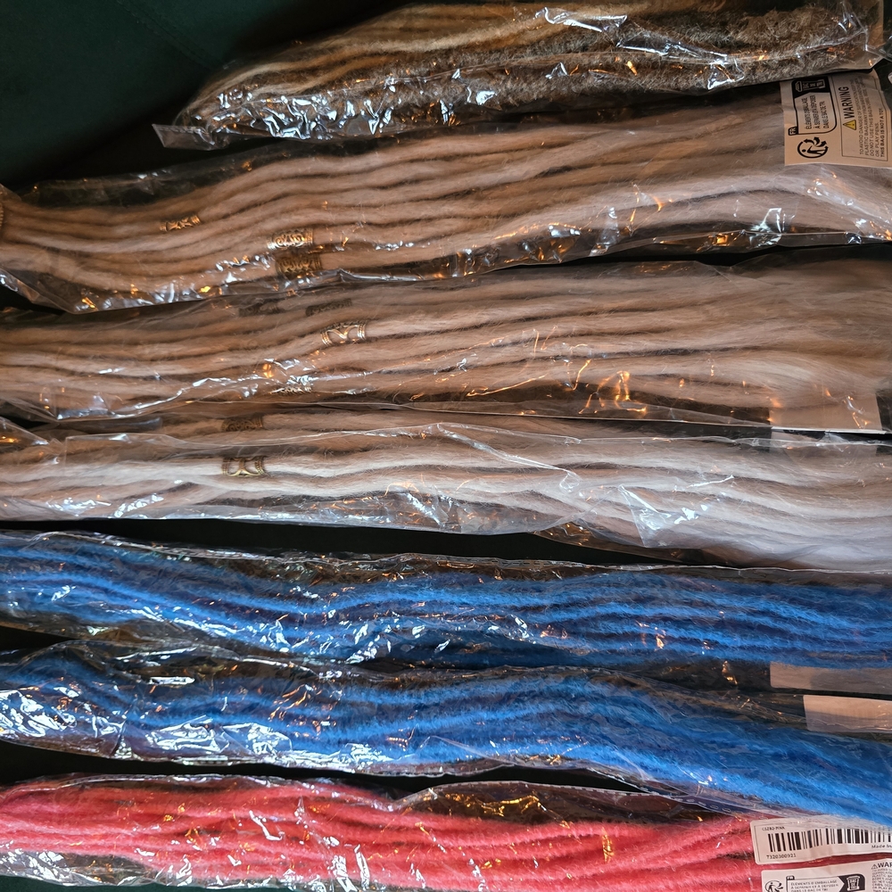 Assorted Dread Hair Extensions in Blue, Pink, and Natural Shades